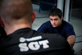 Two Marines engage in a conversation, click here to download the photo