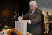 U.S. Rep. Congressman Hal Rogers of Kentucky 5th District places the final placement of a scale pile model cast of the Foundation Remediation Concrete pile that was cast from final barrier wall concrete placment on March 6, 2013 at a Completion Ceremony of rehabilitation work for the Wolf Creek at the Russell County schools Auditorium/Natatorium April 19, 2013.