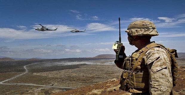 U.S. Marines Corps Capt. Rob Gambrell, a joint terminal attack controller assigned to the 1st Battalion , 3rd Marine Regiment, uses a radio to call out target information to a UH-1Y Venom helicopter and an AH-1W SuperCobra helicopter assigned to Marine Light Attack Helicopter Squadron (HMLA) 169 during a close air support live-fire combat training mission at Pohakuloa Training Area, Hawaii, July 23, 2012, during Rim of the Pacific (RIMPAC) 2012. RIMPAC is a U.S. Pacific Command-hosted biennial multinational maritime exercise designed to foster and sustain international cooperation on the security on the world’s oceans. DoD photo by Tech. Sgt. Michael R. Holzworth, U.S. Air Force 