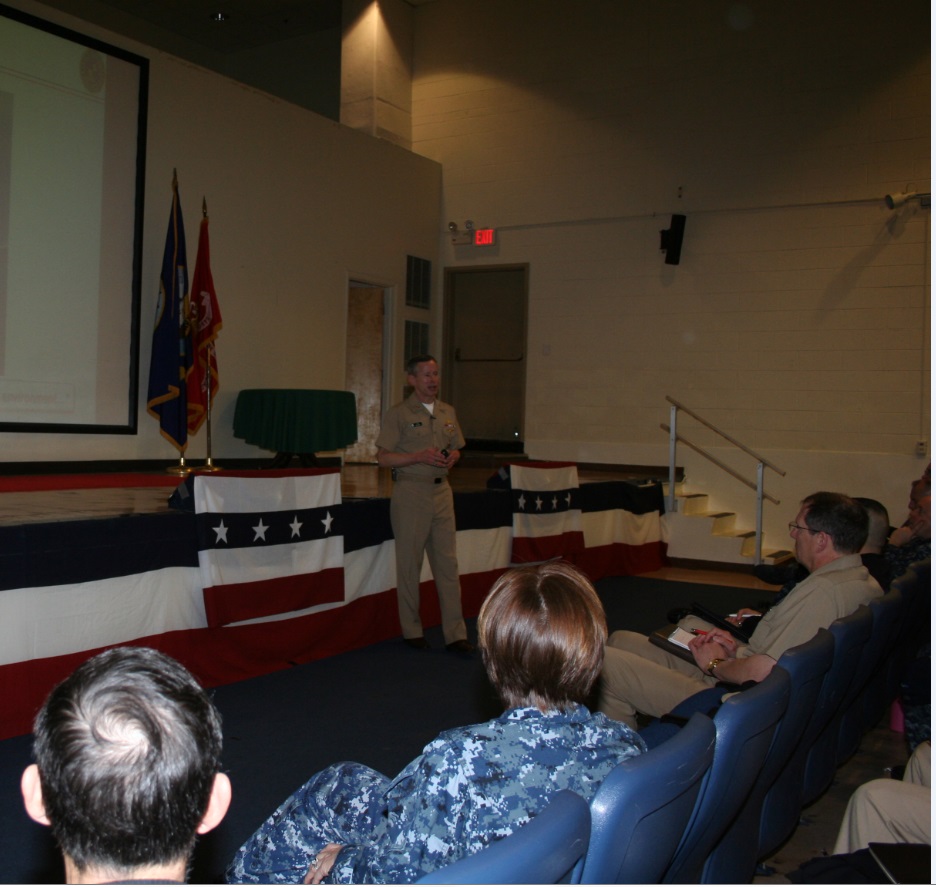 Vice Adm ted N. "Twig" Branch, Deputy Chief of Naval Operations for Information Dominance (N2/N6)  addresses an audience officers, chiefs and civilians from the Information Warfare Community (IWC)  during a town hall meeting in Norfolk on 3 February 2016. Vice Adm Branch spoke on the rebranding of the IWC as well as on the CNO's Campaign Design.