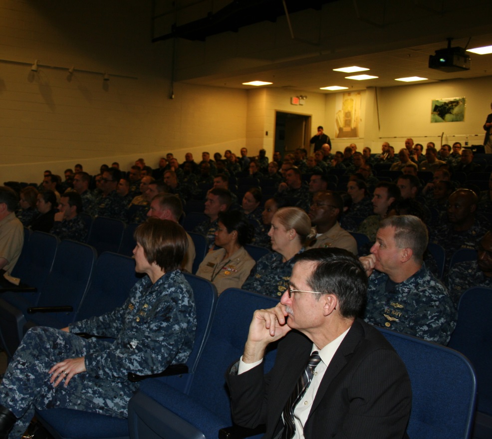 Officers, Chiefs and civilians from the Navy's Information Warfare Community (IWC), listen intently as Vice Admiral Ted N. "Twig" Branch, Deputy Chief of Naval Operations for Information Warfare (N2/N6) and leader of the IWC, discusses the CNO's Campaign Design during a town hall session in Norfolk on 3 February 2016.