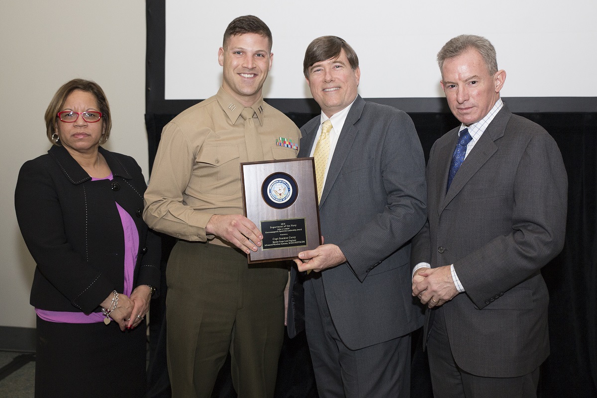 Mr. Robert Foster, Department of the Navy Chief Information Officer (DON CIO); Ms. Janice Haith, Director, DON Deputy CIO (Navy); and Mr. Kenneth Bible, Deputy Director, HQMC C4, U.S. Marine Corps, presented the John J. Lussier Electromagnetic Spectrum Leadership Award to Capt Carey during the awards ceremony at the DON IT West Coast Conference on February 17, 2016.