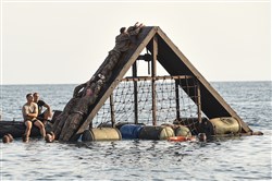 ARTA PLAGE, Djibouti – U.S. Army Soldiers from the 1st Battalion, 124th Infantry Regiment, assigned to Combined Joint Task Force-Horn of Africa, complete a water obstacle course as part of the French Marines Desert Survival Course, Oct. 10, 2016, at Arta Plage, Djibouti. Approximately 46 U.S. Army Soldiers with French Marines completed several tasks during the survival course, including desert operations, combat lifesaving skills, weapons training, survival cooking, how to decontaminate water, and water and mountain obstacle courses. (U.S. Air Force photo by Staff Sgt. Tiffany DeNault)