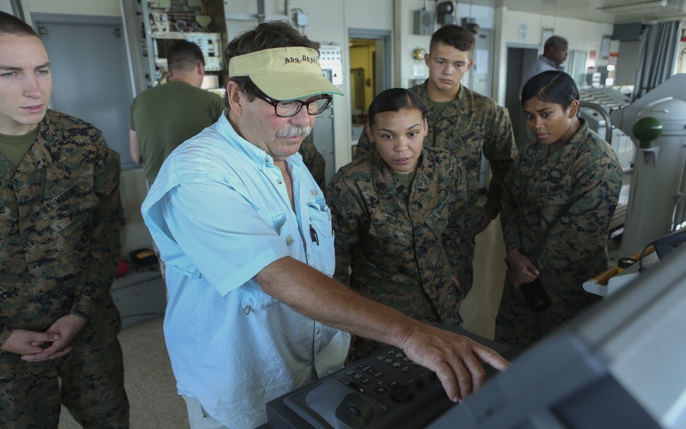 U.S. Marines with Headquarters Regiment, 2nd Marine Logistics Group receive a tour of the bridge from Bill Heinemann, 3rd Mate on the SS Wright (T-AVB 3), during exercise Bold Alligator 16 in the Atlantic Ocean, Aug. 9, 2016. Bold Alligator is a joint service exercise held annually in order to ensure service members are capable of sustaining themselves while at sea.  U.S. Marine Corps photo by Lance Cpl. Tyler W. Stewart/Released 
 
