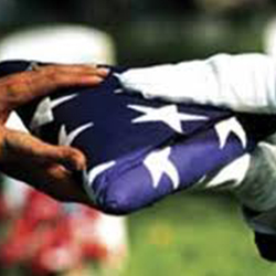 Service members transferring a flag.