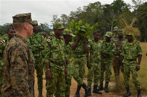 Lance Cpl. Michael Kelly, a Marine with Special-Purpose Marine Air-Ground Task Force Africa 14, leads an assault on an objective during training in Gabon, June 13, 2014. A team of 15 Marines and sailors trained with their Gabonese counterparts from the Agence Nationale des Parcs Nationaux and the Gabonese military and Gendarmerie to demonstrate tactics that could then be applied to combat all types of illicit activities, to include narcotics trafficking.