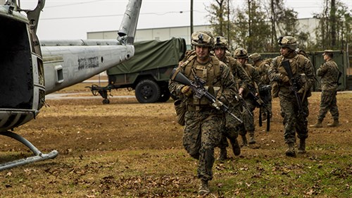 MARINE CORPS BASE CAMP LEJEUNE, North Carolina - Marines with 2nd Battalion, 8th Marine Regiment practice entering and exiting the MV-22B Osprey during a simulated Tactical Recovery of Aircraft and Personnel, or TRAP, mission aboard Marine Corps Air Station New River, Dec. 9, 2014. The TRAP training provides designated forces tactical training and initial evaluation in order to conduct search and personnel recovery operations for the upcoming deployment with Special-Purpose Marine Air-Ground Task Force Crisis Response-Africa. (Photo by U.S. Marine Lance Cpl. Krista James)