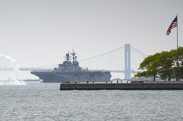 NEW YORK (May 25, 2016) The amphibious assault ship USS Bataan (LHD 5) transits between Liberty Island and the Verrazano Bridge during the Parade of Ships to kick off Fleet Week New York 2016. Fleet Week New York, now in its 28th year, is the city's time-honored celebration of the sea services. It is an unparalleled opportunity for the citizens of New York and the surrounding tri-state area to meet Sailors, Marines and Coast Guardsmen, as well as witness firsthand the latest capabilities of today's maritime services. U.S. Navy photo by Chief Mass Communication Specialist Travis Simmons.