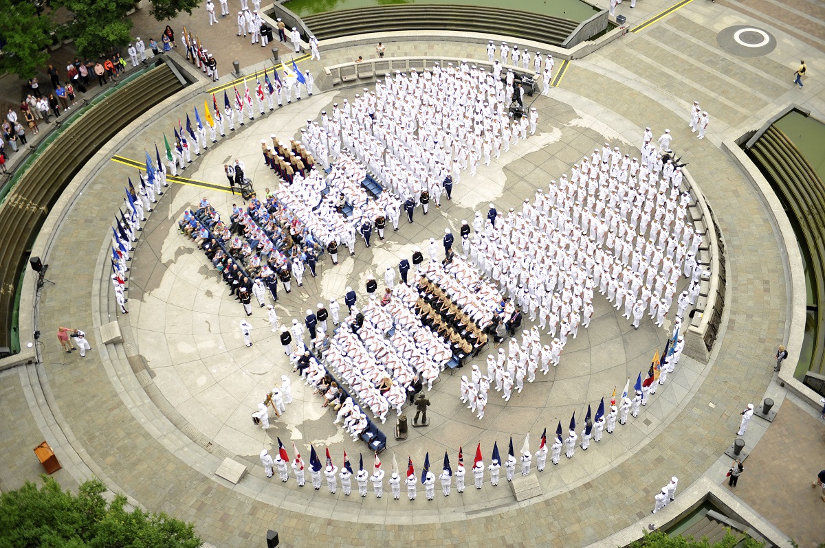 WASHINGTON (June 3, 2016) Sailors, Marines, and Coast Guardsmen parade the 56 state and territorial flags during the 74th Commemoration of the Battle of Midway at the U.S. Navy Memorial. The Battle of Midway was the turning point in the Pacific theater of World War II and set the stage for the United States victory over Japan.  U.S. Navy photo by Mass Communication Specialist 1st Class Pedro A. Rodriguez/Released 