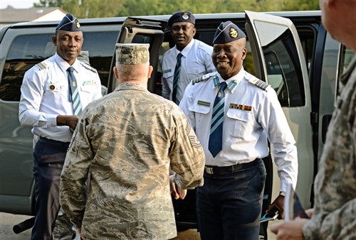 Chief Master Sgt. Chris Moore, Kisling NCO Academy commandant, greets Col. Appiah-Agyekum of the Ghana air force as he and his team arrive at the Academy on Kapaun Air Station, Germany Sept. 25, 2013. Leaders of Ghana's air force visited the NCO academy to better understand how the U.S. Air Force develops its enlisted force. They plan on taking the information back to develop their own professional military education program in Ghana. (U.S. Air Force photo/ Staff Sgt. Ryan Crane)