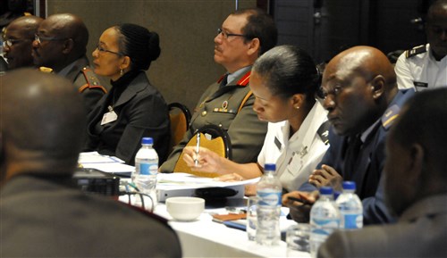 Col. Sara V. Simmons, U.S. Army Africa G-1, personnel director, takes notes during the speakers at the opening ceremony for the Regional Gender Mainstreaming Seminar in Windhoek, Namibia, June 24. The seminar is hosted by the Namibian Defence Forces and co-sponsored by U.S. Africa Command and USARAF. Leaders from seven local countries were in attendance. (U. S. Army Africa photo by Julie M. Lucas)