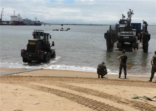 MONROVIA, Liberia - U.S. Navy personnel and equipment from Naval Mobile Construction Battalion Three, stationed in Rota, Spain, are transported to shore in Monrovia, Liberia by amphibious landing craft attached to the Dutch Africa Partnership Station (APS) platform HNLMS Johan de Witt (L 801), October 17, 2009.  The Seabees are in Liberia to rebuild the Liberian Coast Guard base that was destroyed by factional groups in the country's 2005 civil war.  Johan de Witt, a Royal Dutch Naval vessel, is the first European-led APS platform and is augmented by staff from Belgium, Portugal and the United States.  APS, originally a U.S. Navy initiative, is now an international effort aimed at improving maritime safety and security in Africa through training and other collaborative activities. (U.S. Marine Corps Photo by Gunnery Sergeant Michael Maschmeier)