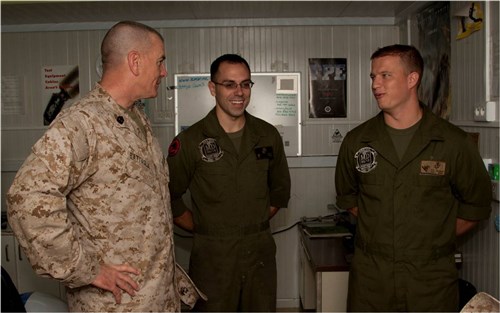 CAMP LEMONNIER, Djibouti (April 22, 2012) - While visiting the flight line, U.S. Marine Corps Sgt. Maj. Bryan B. Battaglia, Senior Enlisted Advisor to the Chairman, Joint Chiefs of Staff, speaks with Marines of Heavy Marine Helicopter 461 stationed here April 22. Battaglia visited personnel assigned to Camp Lemonnier, Combined Joint Task Force - Horn of Africa and other tenant commands to tour the area of operations and assess the morale and well-being of all service members deployed here. (U.S. Air Force photo by Senior Airman Lael Huss)