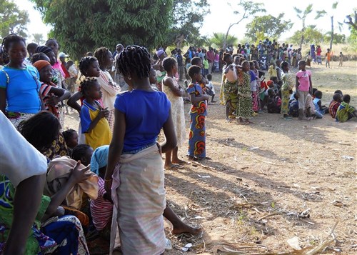 People from the village of Samagan in the Bobo-Dioulasso district of Burkina Faso attend a soccer field dedication ceremony November 26, 2011 as part of a program that unites villages throughout Burkina Faso with troops assigned to protect them. (Photo by SOCAFRICA Public Affairs)