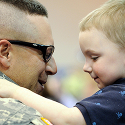 Service member with his son.l