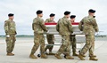 The skeletal remains of the possible U.S. soldiers were solemnly carried to an awaiting vehicle by the U.S. Army Old Guard ceremonial team, under the watchful gaze of senior military, university and government leaders. (U.S. Air Force photo)