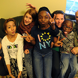 Parents sitting on a couch with their children