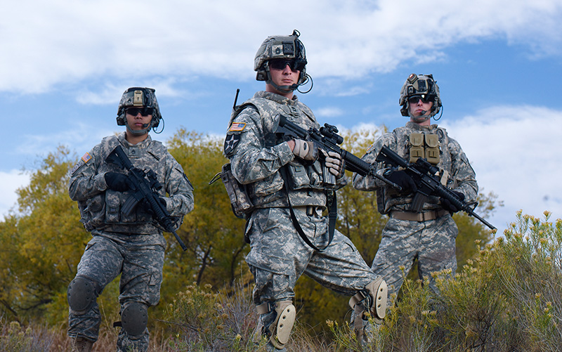 Three U.S. Army Soldiers holding weapons