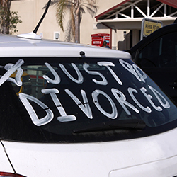 A car with “Just Divorced” written on the window