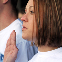 A woman raises her hand and speaking.