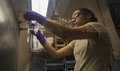 Air Force Senior Airman Latoya Kirven, 455th Expeditionary Medical Group pharmacy technician, makes an intravenous medication for patients within the Craig Joint Theater Hospital at Bagram Airfield, Afghanistan.