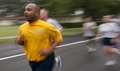 Navy Information Systems Technician 1st Class Lydale Hyde, assigned to Naval Air Facility Misawa, crosses the finish line during the base's monthly readiness run.