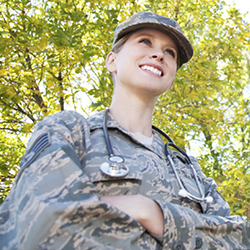 Female service member with a stethoscope around her neck