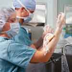 Doctors washing hands before surgery.