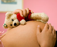 pregnant Mom with teddy bear