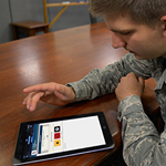 Man working on a tablet using Military OneSource Mobile Solutions