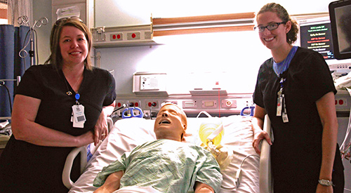 VA nurses Heather Frank (L) and Jill Jefferson along with Simulator SAM during ICU simulation training at the VA medical center in Des Moines, Iowa.