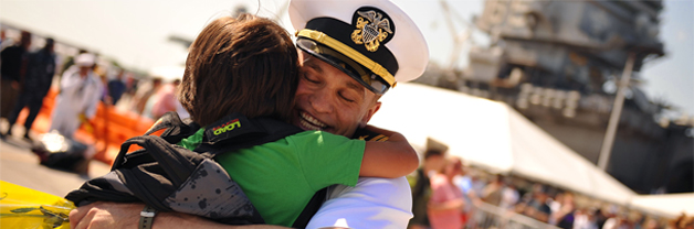 Service member hugging family member upon return from deployment