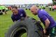 1st Lt. Brandon Taylor and  Master Sgt. Stephen Moneer, 15th Operational Weather Squadron, participates in the 2016 Unit Fitness Challenge work together in teams to flip a heavy tire in the quickest time, May 20, 2016, Scott Air Force Base, Ill. This was the fourth UFC to take place at Scott AFB, and the team oriented-activities also included a Humvee push, a pull up hold, a 5K run and a 10K run. The teams of 10 were made up of different organizations across the base. (U.S. Air Force photo by Senior Airman Erica Fowler)