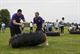 Staff Sgt. Gregory Egger and Capt. Christa Zaiser, 15th Operational Weather Squadron, compete in the tire flip competition during the Unit Fitness Challenge May 20, 2016 at Scott Air Force Base, Illinois. The event encouraged competition and camaraderie amongst units from around the base such as Air Mobility Command, U.S. Transportation Command and many others. (U.S. Air Force photo by Tech. Sgt. Jonathan Fowler)