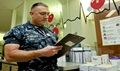 Ensign Joshua Mondloch, a nurse assigned to Naval Medical Center San Diego, takes notes in the cardiology in-patient ward. More than 1,000 active duty and civilian nurses provide patient care throughout the medical center. (Photo by Mass Communication Specialist Second Class John O’Neill Herrera)