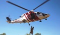 U.S. Navy Lt. Matthew Case, flight surgeon, and U.S. Navy Petty Officer 3rd Class Juan Garcia, hospital corpsman, are hoisted into a Sikorsky S76A++ Search and Rescue helicopter while conducting SAR training during Exercise Pitch Black 2016 at Royal Australian Air Force Base Tindal, Australia. (U.S. Marine Corps photo by Cpl. Nicole Zurbrugg)