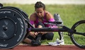 Army Capt. Kelly Elmlinger prepares her stocking for her lower-leg prosthetic at Joint Base San Antonio while training for the Department of Defense Warrior Games. 