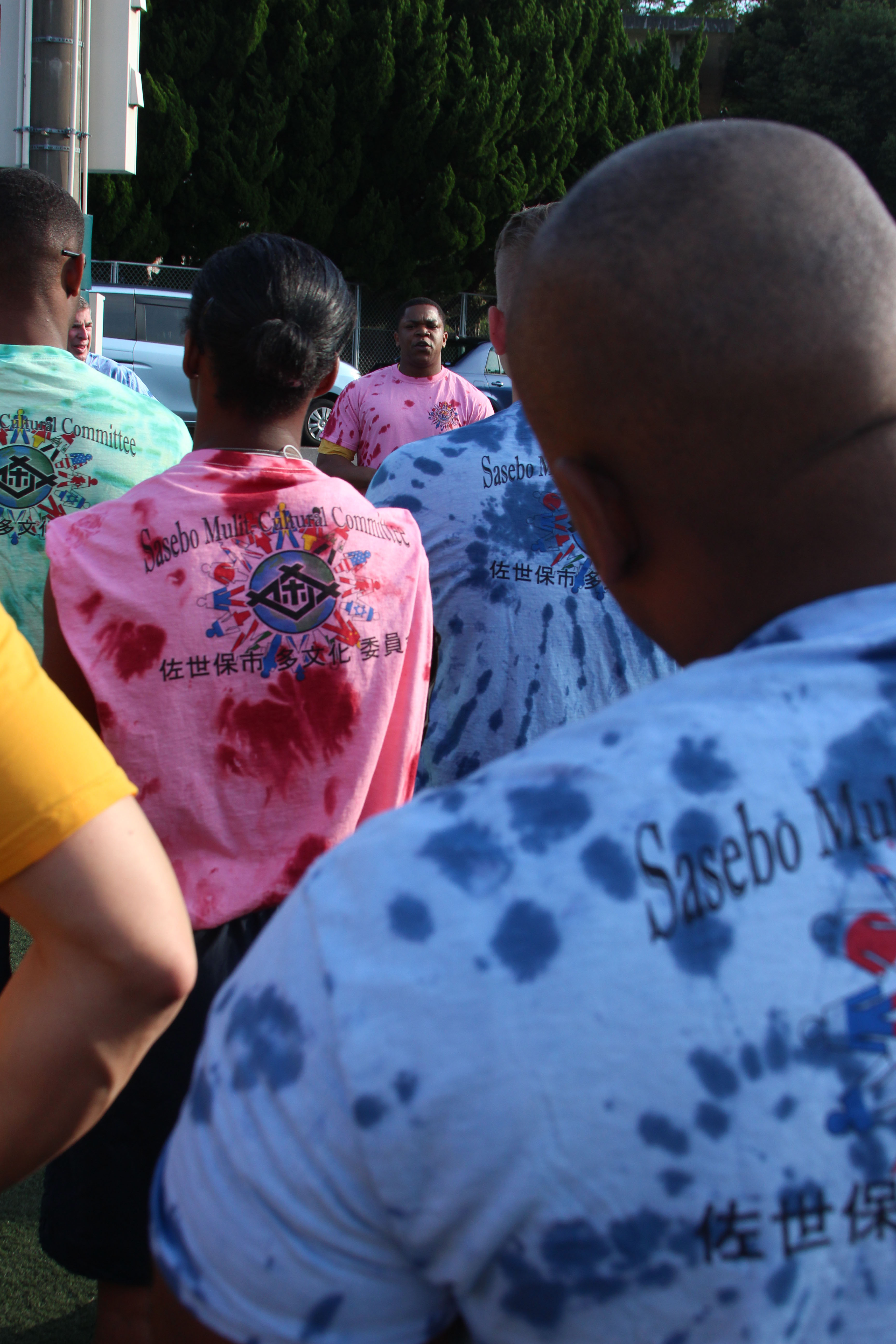 SASEBO, Japan (June 14, 2016) Culinary Specialist 1st Class Brandon Alexander, Commander, U.S.  Fleet Activities Sasebo Multi-cultural Committee president, speaks before a PT session about LGBT Pride Month. Many Sailors at the event wore T-shirts with the colors of the LGBT flag in honor of the month. LGBT Pride Month is held annually to recognize the importance of diversity within American society as well as the achievements of LGBT individuals. (U.S. Navy photo by Mass Communication Specialist 1st Class David R. Krigbaum/Released)