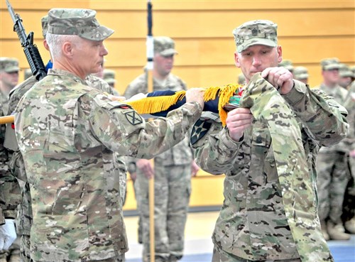 Lt. Gen. James Terry (left), V Corps commander, and V Corps Command Sgt. Maj. William Johnson case the colors in a ceremony in Wiesbaden, Germany, May 10, 2012, in preparation for the corps' deployment to Afghanistan.