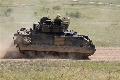 A M2A3 Bradley Fighting Vehicle from 5th Squadron, 7th Calvary Regiment conducts maneuvers as part of a section gunnery qualification at Camp Ujmajor, Hungary July 21. The squadron continues to progress through their gunnery qualification tables as they build up to a Combined Arms Live Fire Exercise in August.