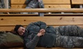 Air Force Senior Airman Karen Machado takes a nap before going to a deployed location. 