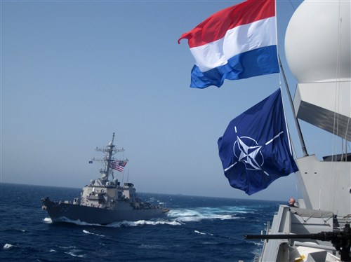 MEDITERRANEAN SEA (Mar. 11, 2011) - The Arleigh Burke-class guided-missile destroyer USS The Sullivans (DDG-68) steams alongside the Royal Netherlands navy frigate HNLMS De Ruyter (F804) while conducting at-sea training. The HNLMS De Ruyter is one of three ships that make up Standing NATO Maritime Group 1 and are deployed in support of Operation Active Endeavour. 