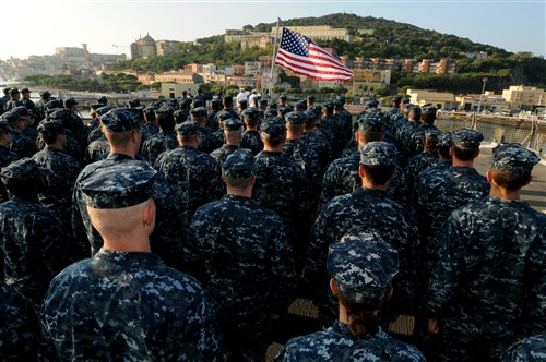 GAETA, Italy  - The crew of USS Mount Whitney (LCC 20) and embarked U.S. 6th Fleet staff attends morning colors on the flightdeck of the ship as part of a ceremony to remember those who lost their lives during the terrorist attacks on Sept. 11, 2001. Mount Whitney, homeported in Gaeta, Italy, is the U.S. 6th Fleet flagship and operates with a combined crew of U.S. Sailors and MSC civil service mariners. The civil service mariners perform navigation, deck, engineering, laundry and galley
service operations while military personnel aboard support communications, weapons systems and security. 