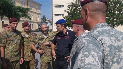 Members of the local Italian carabinieri talk with Soldiers from the rear detachment of U.S. Army Europe's 173rd Airborne Brigade Combat Team about their deployment experiences during a cross-cultural awareness and information operations training session at the carabinieri compound in Vicenza, Italy, Sept. 11.