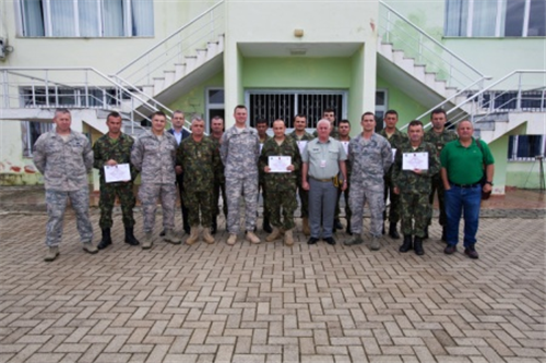Albanian Army officers and explosive ordnance disposal Airmen from the 177th Fighter Wing, New Jersey Air National Guard, along with Albanian Army EOD soldiers pose for a group photo at Peze Helmes, Republic of Albania, Sept. 26, 2014. In September 2014, the 177th EOD team trained Albanian Army EOD soldiers to become level 1 EOD trainers. New Jersey National Guard Airmen and Soldiers have been training their Albanian counterparts for more than 20 years as part of the State Partnership Program between the state of New Jersey and the Republic of Albania. (U.S. Air National Guard photo by Master Sgt. Mark C. Olsen /Released)

