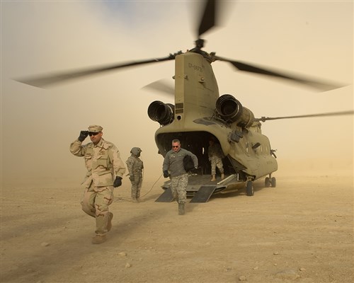Admiral James Stavridis exits a Chinook during his trip to Afghanistan.