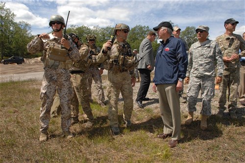 Michigan Governor Rick Snyder is briefed on close air support techniques by a combined Michigan National Guard and Latvian Armed Forces Joint Terminal Attack Controller team at the Camp Grayling Air Gunnery Range, Mich., on Aug 11, 2013 during Operation Northern Strike, 2013.
Operation Northern Strike is a National Guard Bureau sponsored, combined arms live-fire exercise held in northern Michigan. During ONS, participants from all branches of the U.S. Armed Forces, 16 states, and coalition partner nations, Latvia and Canada, contributed to provide requirements-based training. The exercise emphasized doctrinal elements of the Theater Air Control System and Army Air-to-Ground System with additional emphasis on the integration of Joint Fire Support, Air Operations Center and Maritime Control operations. 