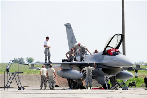 Maintenance crews from the California and Alabama Air National Guard replace an Air Data Controller on an F-16 during SAFE SKIES 2011. The Air National Guard is in Ukraine supporting SAFE SKIES 2011, a 2-week multinational flying event preparing Ukraine and Poland to better protect their airspace during the 2012 EUROPCUP.   (U.S. Air Force Photo by Tech. Sgt. Charles Vaughn, 144 FW/PA / Released)