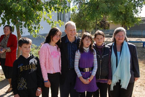 U.S. Ambassador to the Republic of Moldova William Moser and Mrs. Moser with students from the Bolohan School where the United States is completing a $510,000 renovation. The renovation of the Bolohani School is a two phase project. Phase One – the construction of new sanitary facilities was completed last week, and now students and faculty have access to indoor bathroom facilities. Phase Two – the complete renovation of the school and its gymnasium will begin in December.