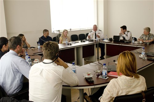 A team from U.S. European Command sits down for a discussion during their four-day training in Pristina June 20. The goal of the training was to get all members of the public relations team to communicate with one voice.
